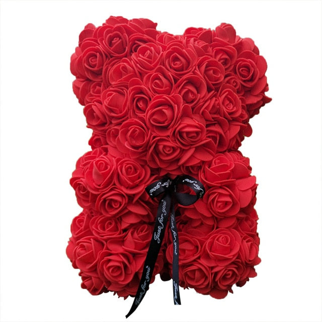 Ours en peluche avec des roses de fleurs artificielles