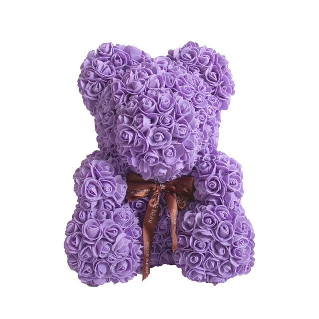 Ours en peluche avec des roses de fleurs artificielles