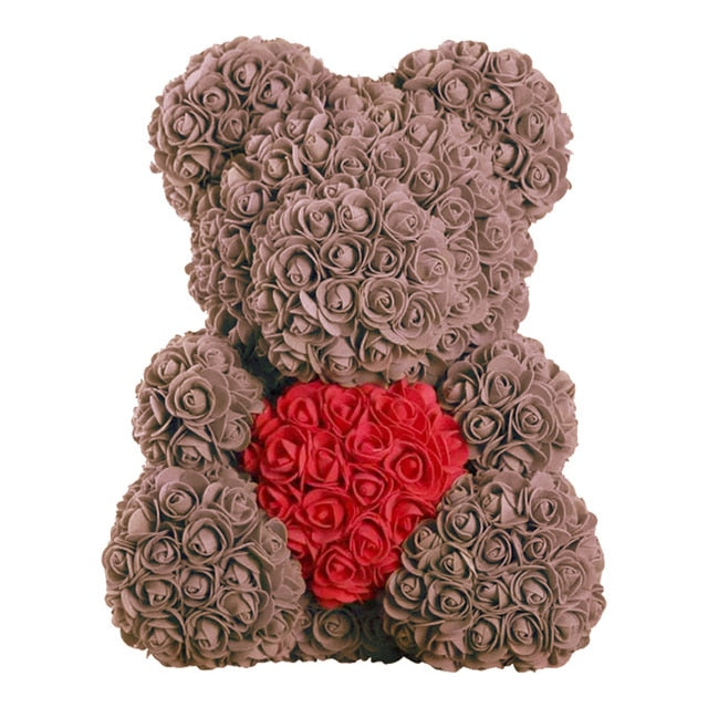 Oso de peluche con rosas de flores artificiales.