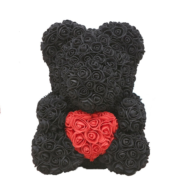 Oso de peluche con rosas de flores artificiales.