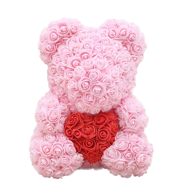 Ours en peluche avec des roses de fleurs artificielles